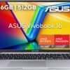 Vista frontal de la laptop ASUS Vivobook 16 M1605YA abierta, destacando su teclado con sección numérica y los logotipos de AMD Ryzen y Radeon en el chasis.