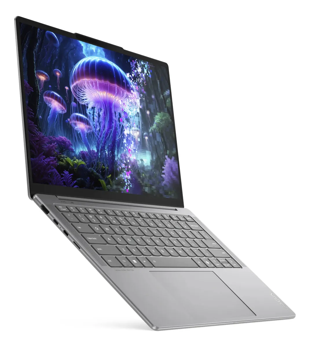 Perfil ultra delgado y puertos laterales Perfil ultra delgado de laptop mostrando puertos laterales USB-C y teclado en español