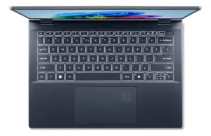 Vista cenital del teclado retroiluminado y panel táctil de una computadora portátil Acer.
