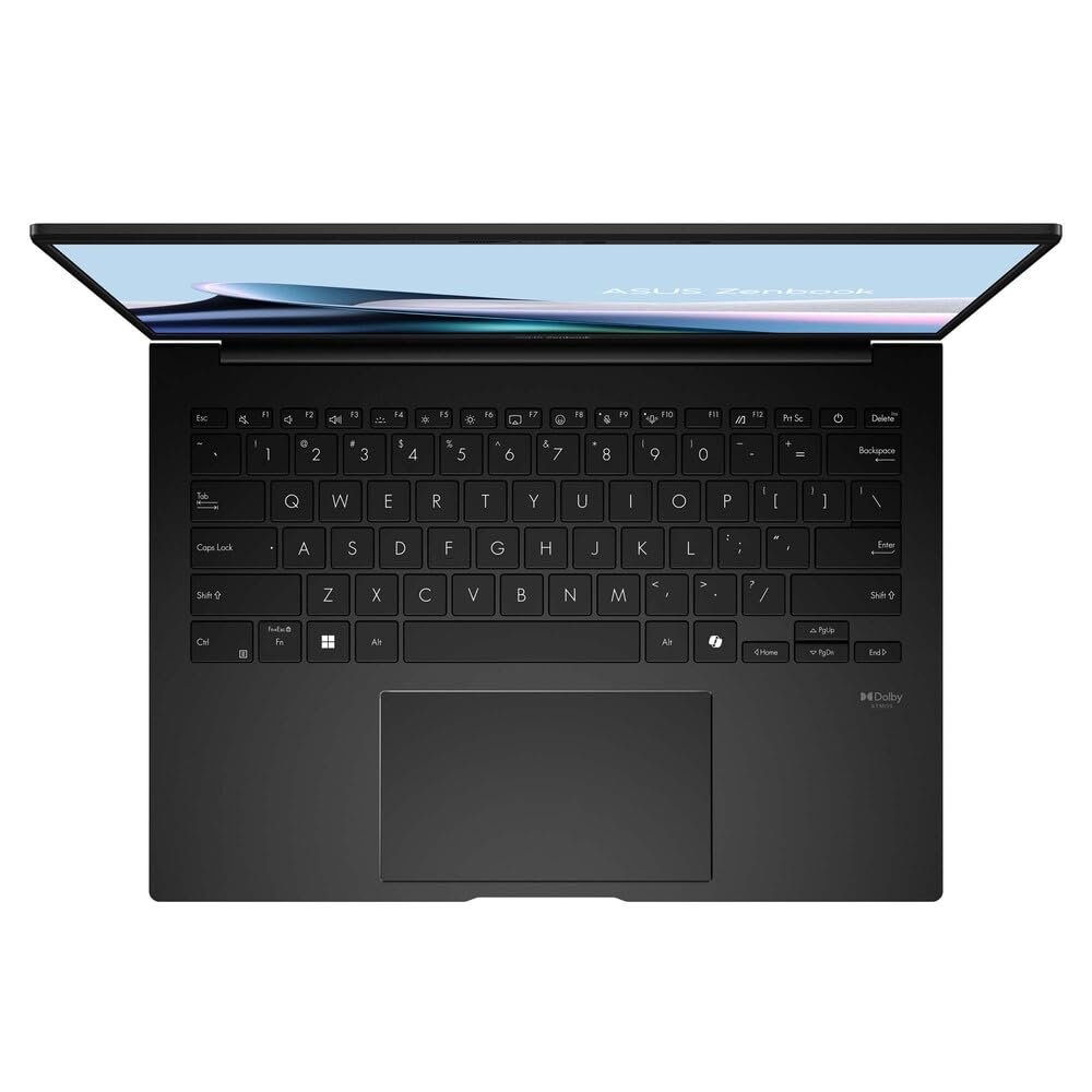 Vista superior de laptop Asus Vista cenital de laptop negra abierta mostrando teclado QWERTY y panel táctil.