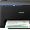 Impresora epson ecotank l3251 con botellas de tinta de colores y hoja impresa.