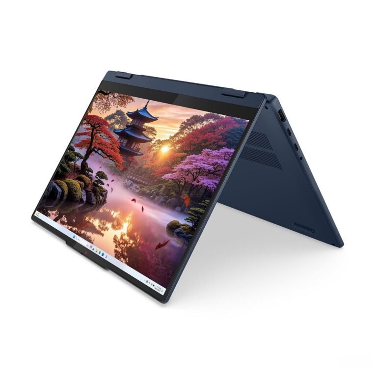 Laptop azul en modo tienda mostrando un paisaje japonés en la pantalla.